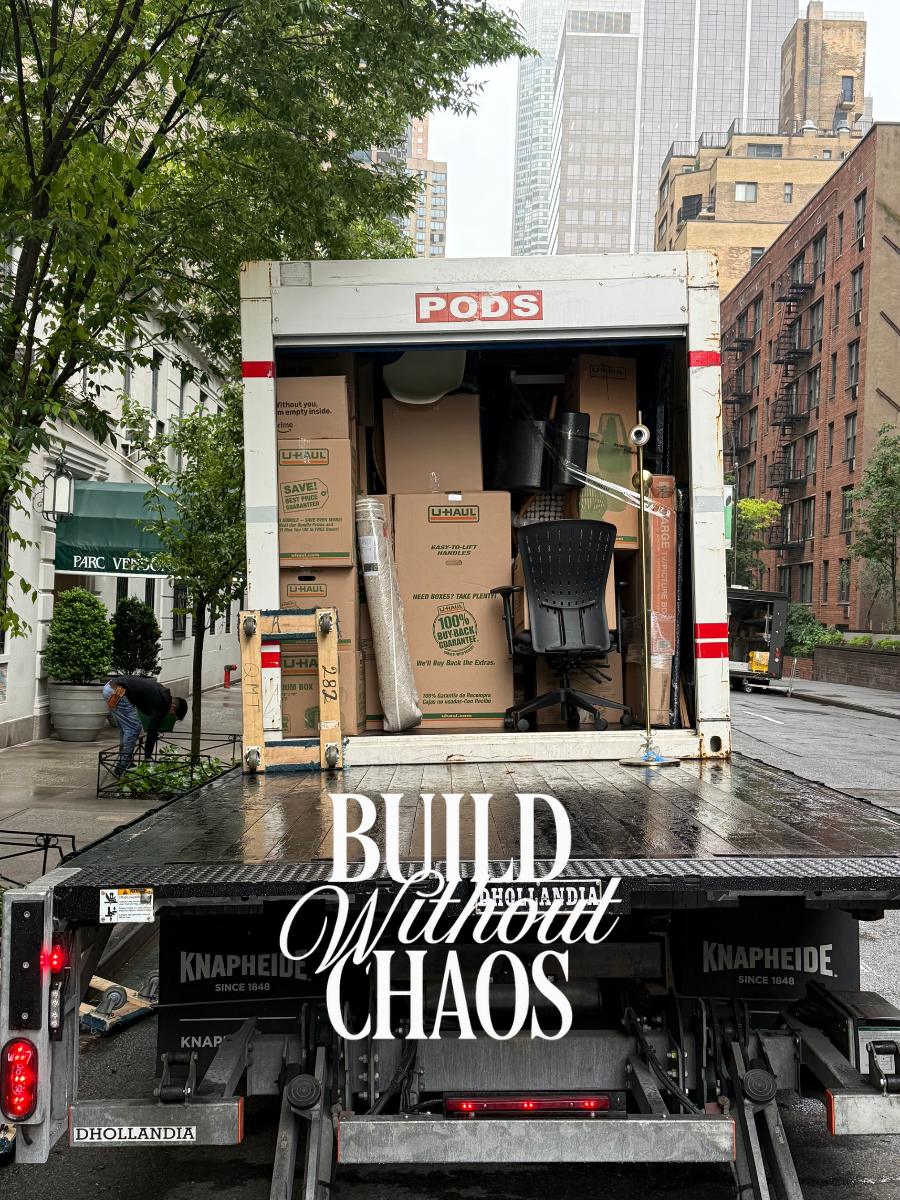 Build Without Chaos, a moving truck loaded with boxes on a city street